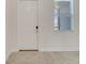 Inviting entryway with light tile floors, a modern front door, and a bright window at 4672 Tribute Trl, Kissimmee, FL 34746