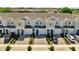 Charming townhomes with two-car garages, beautiful landscaping, and paved driveways at 4672 Tribute Trl, Kissimmee, FL 34746