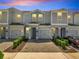 Charming townhome with brick driveway, one car garage, and manicured landscaping at 4672 Tribute Trl, Kissimmee, FL 34746