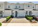 Charming townhome with brick driveway, one car garage, and manicured landscaping at 4672 Tribute Trl, Kissimmee, FL 34746