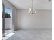 Bright living room featuring tile flooring and sliding door access to patio at 4672 Tribute Trl, Kissimmee, FL 34746