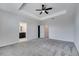 The main bedroom features a tray ceiling, fan, and access to the bathroom at 4672 Tribute Trl, Kissimmee, FL 34746