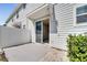 Exterior view of cozy patio area with privacy fence and sliding glass door to the home at 4672 Tribute Trl, Kissimmee, FL 34746