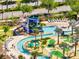 Resort style water park with lazy river, water slides, splash area, and lounge chairs at 4672 Tribute Trl, Kissimmee, FL 34746