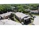 An aerial view of a two-story apartment complex featuring well-maintained landscaping and an ample parking area at 4858 S Semoran Blvd # 2108, Orlando, FL 32822