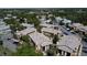 Aerial view of the neighborhood featuring multiple residential buildings, trees, and parking areas at 4858 S Semoran Blvd # 2108, Orlando, FL 32822