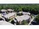 Aerial view of community homes with trees, landscaping, and parking areas at 4858 S Semoran Blvd # 2108, Orlando, FL 32822