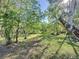 Backyard view with lush lawn, highlighting the property's expansive green space and natural surroundings at 4858 S Semoran Blvd # 2108, Orlando, FL 32822