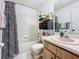 Cozy bathroom featuring a shower/tub combo, vanity, and ample space at 4858 S Semoran Blvd # 2108, Orlando, FL 32822