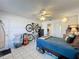 Functional bedroom with ceiling fan, closet, and adjacent bathroom, offering comfortable space at 4858 S Semoran Blvd # 2108, Orlando, FL 32822