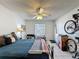Bedroom with ceiling fan and natural light from the window, providing a bright atmosphere at 4858 S Semoran Blvd # 2108, Orlando, FL 32822