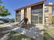 Charming two-story condo featuring dual screened in patios with garden bed and sidewalk entrance at 4858 S Semoran Blvd # 2108, Orlando, FL 32822