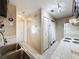 Kitchen offers white appliances, tile floor and countertops, and ample cabinet space at 4858 S Semoran Blvd # 2108, Orlando, FL 32822