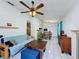 Bright living area offering tile flooring, an open layout, and a clear view into the dining space at 4858 S Semoran Blvd # 2108, Orlando, FL 32822