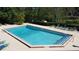 Community pool with seating and clear blue water, offering a refreshing amenity for residents and guests at 4858 S Semoran Blvd # 2108, Orlando, FL 32822