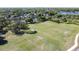 Aerial view of a large soccer field with players, near a pond and walking trail; a great area for exercise and recreation at 4858 S Semoran Blvd # 2108, Orlando, FL 32822