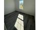 Unfurnished bedroom with window and stylish, modern wood-look floors at 4863 Sw 159Th Ln Rd, Ocala, FL 34473