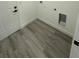 Bright laundry room featuring modern flooring and a conveniently placed dryer hookup at 4863 Sw 159Th Ln Rd, Ocala, FL 34473