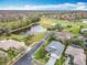 Gorgeous overhead view of a home near a pond and golf course in a serene community at 501 Heartwell Dr, Poinciana, FL 34759