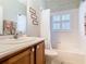 This bathroom features a shower and tub combination with neutral colors at 501 Heartwell Dr, Poinciana, FL 34759