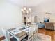 Elegant dining room with a chandelier, seating for six, and an open layout at 501 Heartwell Dr, Poinciana, FL 34759