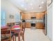 Bright kitchen featuring stainless steel appliances, light wood cabinetry, and granite countertops at 501 Heartwell Dr, Poinciana, FL 34759
