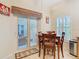 Kitchen nook features a table with seating, sliding glass doors, and backyard access at 501 Heartwell Dr, Poinciana, FL 34759