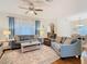 Cozy living room with hardwood floors, comfortable seating, and natural light at 501 Heartwell Dr, Poinciana, FL 34759