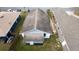 Aerial view of the home showing the roof and surrounding neighborhood at 516 W 7Th St, Lakeland, FL 33805