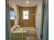 A tiled bathroom with a shower and tub combination at 516 W 7Th St, Lakeland, FL 33805
