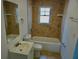 A tiled bathroom with a shower and tub combination at 516 W 7Th St, Lakeland, FL 33805