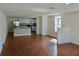 Bright and airy living space with hardwood floors, fresh paint and a kitchen island in the background at 516 W 7Th St, Lakeland, FL 33805