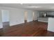 Hardwood floors are featured in this bright and airy living space, with kitchen in the background at 516 W 7Th St, Lakeland, FL 33805