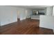 Hardwood floors are featured in this bright and airy living space, with kitchen in the background at 516 W 7Th St, Lakeland, FL 33805