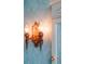 Ornate bathroom wall lamp with a vintage ship design and soft, ambient lighting at 5641 Orange Ave, Intercession City, FL 33848