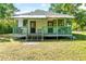 Charming home featuring a quaint, covered porch and inviting curb appeal at 5641 Orange Ave, Intercession City, FL 33848