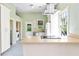 Kitchen featuring white cabinets, stainless steel appliances, and quartz countertops at 5641 Orange Ave, Intercession City, FL 33848