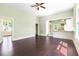 Bright living room with ceiling fan and easy access to kitchen and laundry room at 5641 Orange Ave, Intercession City, FL 33848