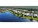 Aerial view of home and waterway with mature trees and beautiful landscaping at 585 Grand Canal Dr, Poinciana, FL 34759