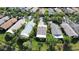 An aerial view of the backyard, landscaping, and roof of the home at 585 Grand Canal Dr, Poinciana, FL 34759