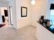 Welcoming entryway featuring tile flooring, a decorative mirror, and a view into the home at 585 Grand Canal Dr, Poinciana, FL 34759