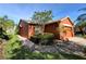Charming single Gathering home with brick paver driveway, lush landscaping, and beautiful curb appeal at 585 Grand Canal Dr, Poinciana, FL 34759