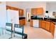 Bright kitchen featuring modern appliances, tile flooring, and ample cabinet space at 585 Grand Canal Dr, Poinciana, FL 34759