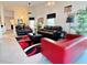 Comfortable living room with neutral walls, contemporary furnishings, and views to multiple areas of the home at 585 Grand Canal Dr, Poinciana, FL 34759