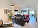 Spacious living area with vaulted ceilings, neutral finishes, and views to the outside and other areas of the home at 585 Grand Canal Dr, Poinciana, FL 34759