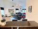 Open-concept living area with black granite counter, showcasing the spacious floor plan and seating at 585 Grand Canal Dr, Poinciana, FL 34759