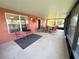 Covered patio area featuring comfortable outdoor seating and relaxing atmosphere at 585 Grand Canal Dr, Poinciana, FL 34759