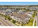 Aerial view of the community with various home styles and landscaping at 7063 Nemours Pkwy, Orlando, FL 32827