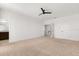 Large primary bedroom features neutral carpet, and a bathroom with a double vanity at 7063 Nemours Pkwy, Orlando, FL 32827