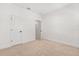 A bright and spacious bedroom with a neutral carpet and white walls at 7063 Nemours Pkwy, Orlando, FL 32827